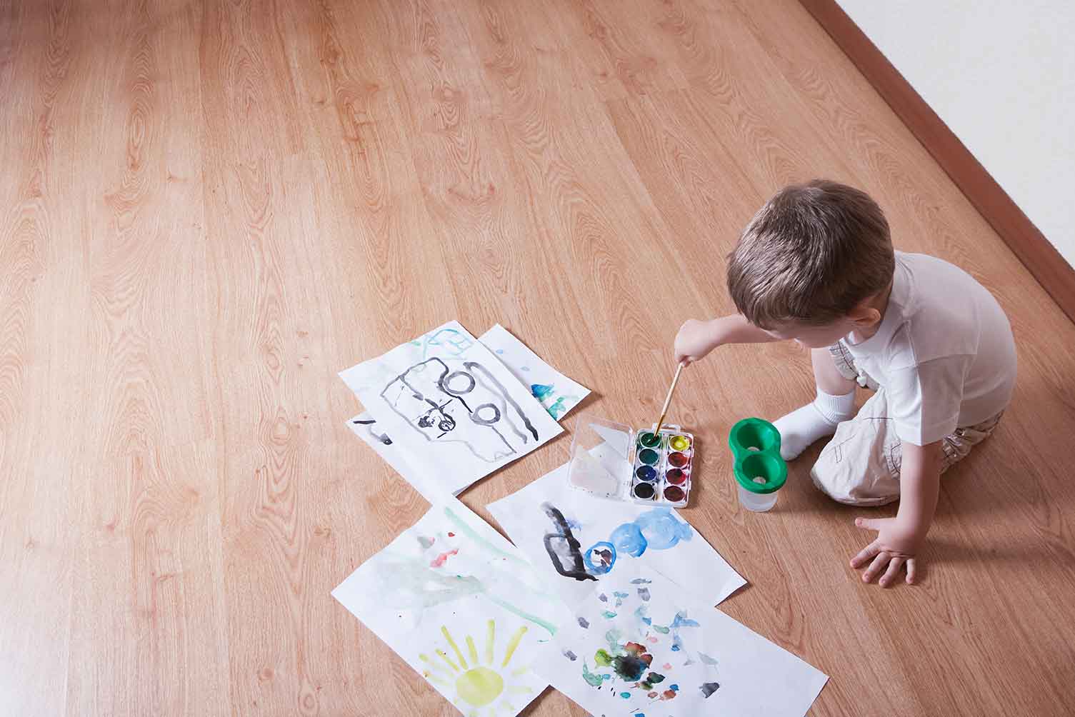 Little boy drawing a picture on the floor | Country Carpet & Furniture
