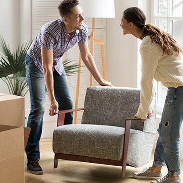 Couple moving sofa | Country Carpet & Furniture